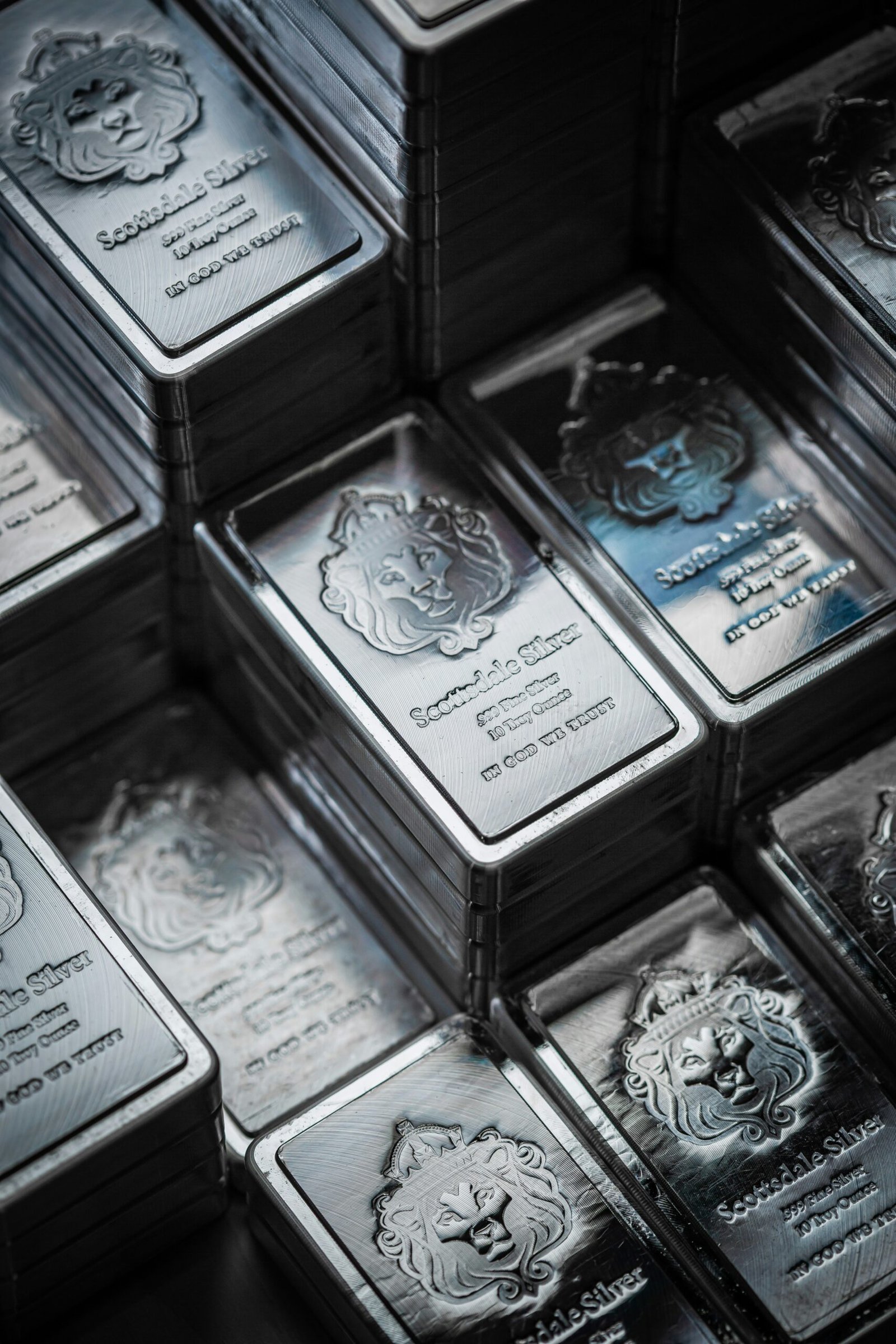 A pile of silver bars stacked on top of each other